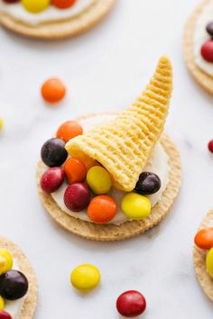 cookies with candy cornucopies on them are arranged in the shape of an ice cream cone