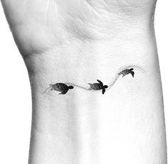 three birds flying in the sky on a woman's left side ribcage