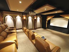 an empty home theater with leather seats