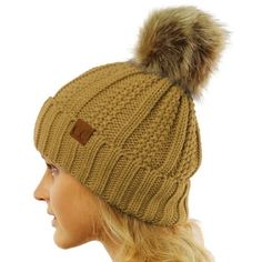 We are adding a little cold weather fun to our most loved C.C beanie. These pom beanies have an added pom on the top of them are lined on the inside. They are comfy, warm, and oh so cozy. The little leather tag is stamped with a registered C.C Size: One Size.  Color: Beige.  Gender: unisex.  Age Group: adult. Bulky Knit, Pom Pom Beanie Hat, Cc Beanie, Leather Tag, Ski Hats, Winter Hats For Women, Faux Fur Pom Pom, Pom Beanie, Comfy Cozy