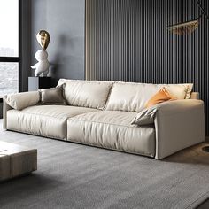 a modern living room with white leather couches and black striped wall behind the sofa