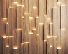 a wooden wall that has some lights on it