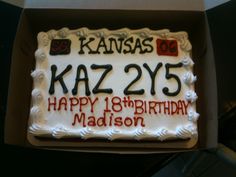 a birthday cake in a box with the name kaz255 happy 18th birthday madison