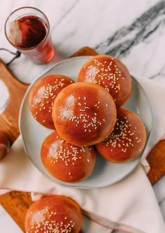 small buns with sesame seeds on a plate