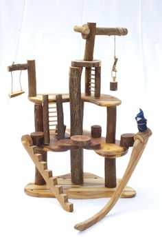 a wooden structure with several pieces of wood on it and a bird perched on the top