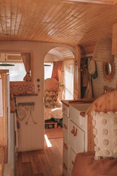 the interior of a tiny home with wood paneling