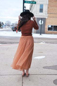 The Elastic Waist Maxi Tulle Skirt is a stunning and versatile addition to your wardrobe. This maxi skirt combines elegance with comfort, making it perfect for a wide range of occasions. Featuring an elastic waist, it offers a customizable and comfortable fit. The skirt is finished with a raw hem, which adds a contemporary touch to its overall design. It is fully lined, both in the body and skirt, providing comfort and coverage. Crafted from 100% polyester for both the self and lining, this skirt offers a luxurious and flowing feel, ensuring you move with grace and style. The model, standing at 5' 9" and with measurements of 31-24-34, is wearing a size Small. Whether you're dressing up for a special event or looking to make a statement with your everyday attire, the Elastic Waist Maxi Tull Elegant Non-stretch Tulle Skirt, Stretch Long Skirt Bottoms For Fall, Stretch Long Skirt For Fall, Tiered Maxi Skirt For Fall Party, Non-stretch Maxi Skirt For Fall, Chic Non-stretch Tulle Skirt, Stretch Maxi Skirt For Fall Party, Flowy Maxi Skirt For Fall Party, Modest Fitted Skirt For Fall