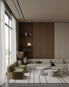 a modern living room with white furniture and wood paneling on the walls, along with large windows