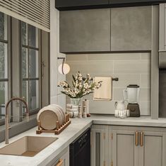 a kitchen with gray cabinets and white counter tops, along with an open window to the outside