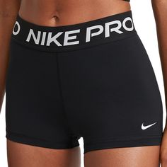 the nike pro women's shorts are black with white letters on them and there is no image to describe