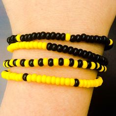 Prepare for the new Twenty One Pilots era with this set of four yellow and black bracelets inspired but their new album Trench. Wear all four as a full set, or keep one for yourself and share the others with your friends! I hand-make each colorful friendship bracelet with clear stretch cord and glass seed beads in patterns inspired by the new album Trench from Twenty One Pilots. Please send me a custom request if you would like to see a certain pattern not listed here!  These bracelets are already tied and ready to wear. They're made with clear stretch cord so it should fit any sized wrist, but If you have any concerns, please feel to let me know if I should make it bigger for a larger wrist or smaller for a child's needs. I love getting custom requests and suggestions, so please feel free Twenty One Pilots Trench, قلادات متدلية, Ankle Bracelets Diy, Mens Beaded Necklaces, Diy Jewelry Rings, Yellow Bracelet, Bracelets Design, Bead Charms Diy, Diy Bracelets Patterns