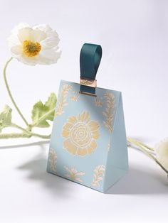 a small blue box with a flower on it