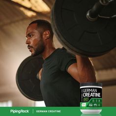 a man lifting a barbell with german creatin in front of his face