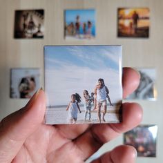 a person holding up a polaroid with pictures on it