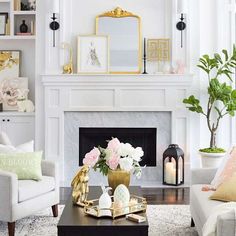 a living room filled with furniture and a fire place in front of a white fireplace