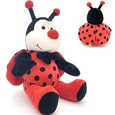 a ladybug stuffed animal sitting on the ground