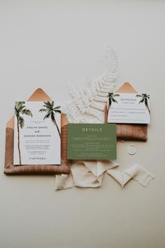 wedding stationery with palm trees and greenery