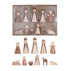 wooden nativity figurines in a gift box with the contents displayed on a white background