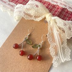 handmade beaded earrings with super cute red cherries 🍒hooks are sterling silver plated, nickel free, and hypoallergenic. each come with clear silicone earring backs. Diy Cherry Earrings, Cherry Beaded Earrings, Trendy Handmade Cherry Jewelry, Trendy Handmade Cherry Colored Earrings, Handmade Cherry Cute Earrings, Handmade Trendy Cherry Earrings, Cherry Earrings, Cherry Bomb, Handmade Earrings Beaded