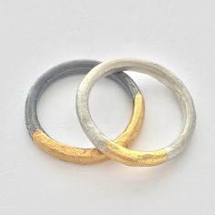 These contemporary silver and gold rings have an organic sculptural form and a modern feel.  Perfect everyday rings, comfortable to wear and ready to make a statement. Created from silver wire, hammered, forged, and heated with soldering torch to reticulate the silver surface, creating a subtle organic texture.  Gold is applied using Keum Boo, an ancient technique fusing 24 gold foil onto the surface of the silver. The gold foil leaves rich gold color. Available in two different finishes the photo represents a matt silver finish with gold and oxidized silver finish with gold.  Please specify your preference in finish option - Matt  - Oxidized - Matt/Oxidized Available as a set or individual.  Set $250, Single $150, please message me if you would like to set up a single ring purchase. Can b Organic Gold Ring, Hammered Metal Jewelry, Keum Boo Jewelry, Silver And Gold Rings, Contemporary Rings, Contemporary Jewellery Designers, Ancient Jewels, Keum Boo, Handmade Silver Jewellery