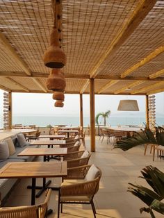 an outdoor dining area overlooking the ocean