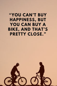 two people riding bikes on top of a hill with a quote above them that reads you can't buy happiness, but you can buy a bike, and that's pretty close