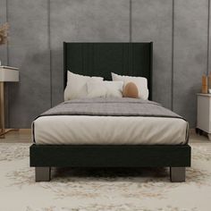 a bedroom with a bed, nightstands and two night stands on either side of the bed