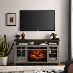 a living room with a television and fireplace