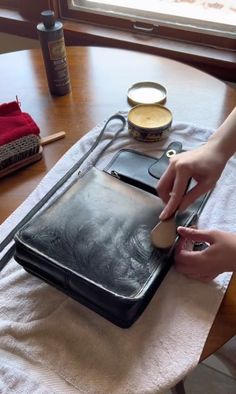 a person is using a tabletop on a table with other items and utensils