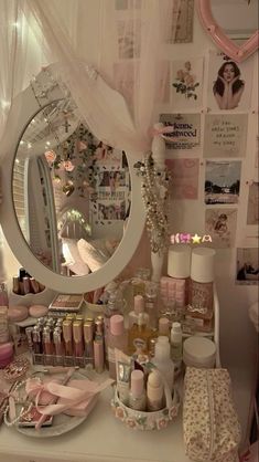 there is a vanity with many items on the table and in front of the mirror