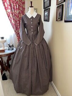 This dress is a size 12 and filts the lovely lady with Bust 34 and Waist 26.5. If we don't have the color / style or size you need, we do special orders! This dress is made from a period pattern - photo copies of the originals. 1860s Fashion Poor, Traditional Formal Cotton Dress, Traditional Cotton Dress For Formal Occasions, Traditional Formal Dress For Fall, Cotton Long Sleeve Dresses With Historical Design, Long Sleeve Cotton Dress With Historical Design, Long Sleeve Cotton Dresses With Historical Design, Historical Cotton Costume Dress, Historical Design Fitted Cotton Dress