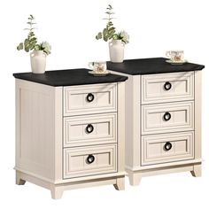 two white dressers with black top drawers and planters on each drawer, both side by side