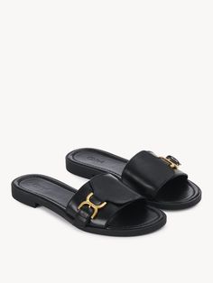 Chloé Marcie Slide | Chloé US Luxury Calf Leather Slides With Buckle Closure, Luxury Calf Leather Mules With Buckle Closure, Designer Leather Sandals With Gold Buckle, Classic Calf Leather Sandals With Buckle, Classic Flat Slides With Removable Insole, Classic Calf Leather Sandals With Buckle Closure, Classic Slides With Removable Insole, Luxury Leather Slides With Tang Buckle, Luxury Leather Sandals With Gold Buckle