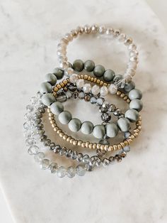 Add some sparkle to your wrist with this stunning Ziona bracelet stack. All bracelets in this stack are made to stretch for easy wear and comfort with the most subtle hint of glimmer. This go-to stack can be worn on its own or stacked with other delicate wristwear for a layered look. THIS ITEM IS FINAL SALE. NO EXCHANGES OR REFUNDS. Details 4 Stack Stretch Bracelets 7” diameter Hypoallergenic All jewelry comes with Harper & Teal engraved canvas pouches to protect the longevity of your purchase S Western Bracelet Stack, Bracelet Stack Ideas, Stretch Beaded Bracelets Diy, Crystal Jewelry Diy, Western Bracelets, Clay Bracelets, Style For Spring, Bracelet Stacks, Teacher Craft