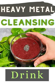 a hand holding a glass filled with liquid next to spinach leaves and the words, heavy metal cleaning drink