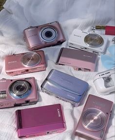 there are many different types of cameras on the bed