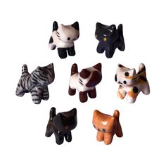 small ceramic animal figurines in various shapes and sizes