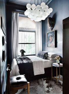 an instagramted photo of a bedroom with blue walls