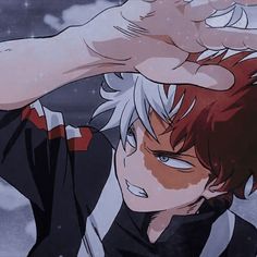 an anime character holding his hand up to his head and looking at the camera, with snow in the background