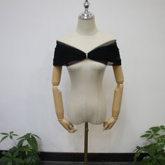 a mannequin wearing a black and white top