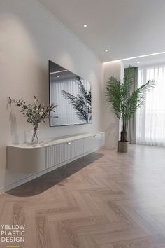 an empty living room with white walls and wood flooring is pictured in this image