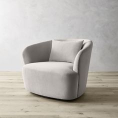 a white chair sitting on top of a wooden floor