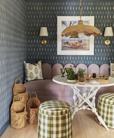 a living room filled with furniture and decor on top of a hard wood floored floor