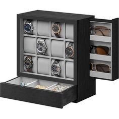 an open watch box with twelve watches in it's display case, and several other items inside