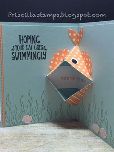 a card with an origami fish on it and the words hoping your day goes swimming