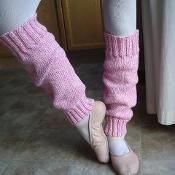 a person with pink socks and ballet shoes