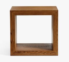 a square wooden table with one section cut out to show the top and bottom part