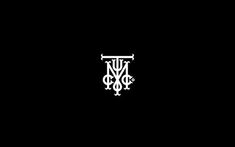 a black and white logo with the letter y in it's center, on a dark background