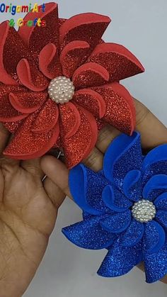 two red, white and blue flower hair clips