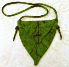 a green piece of cloth hanging from a string